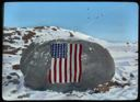 Image of Flag on Memorial Boulder at Cape Sabine